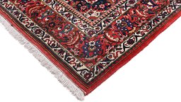 Backside of handmade 1940s Bakhtiar rug showing knot structure and weave density