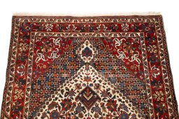 Surface texture of 1940s Bakhtiar rug with natural Wool and intricate pattern