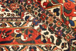 Corner detail of 1940s Bakhtiar rug showing border pattern and Wool pile