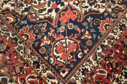 Corner detail of 1930s Bakhtiar rug showing border pattern and Wool pile
