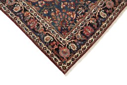Backside of handmade 1930s Bakhtiar rug showing knot structure and weave density