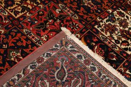 Corner detail of 1930s Bakhtiar rug showing border pattern and Wool pile