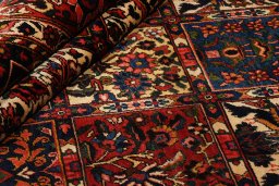 Full view of 1930s Bakhtiar rug from Iran / Persia, 325 × 216 cm in Dark red tones