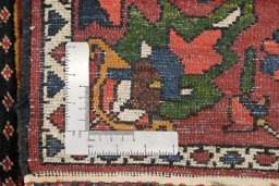 Close-up detail of 1920s Bakhtiar rug from Iran / Persia showing Wool weave