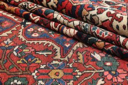 Corner detail of 1900s Bakhtiar rug showing border pattern and Wool pile