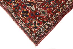 Backside of handmade 1920s Bakhtiar rug showing knot structure and weave density