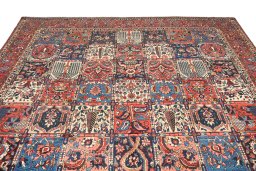 Surface texture of 1930s Bakhtiar rug with natural Wool and intricate pattern
