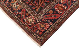 Backside of handmade 1900s Bakhtiar rug showing knot structure and weave density