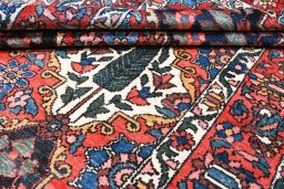 Corner detail of 1950s Bakhtiar rug showing border pattern and Wool pile