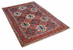 Corner detail of 1950s Bakhtiar rug showing border pattern and Wool pile