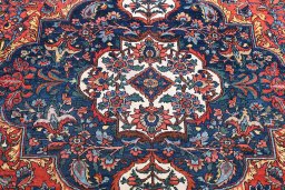 Backside of handmade 1930s Bakhtiar rug showing knot structure and weave density