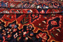 Backside of handmade 1930s Bakhtiar rug showing knot structure and weave density