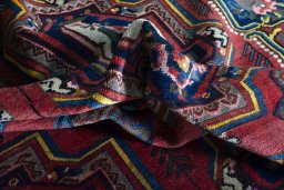 Surface texture of 1930s Bakhtiar rug with natural Wool and intricate pattern