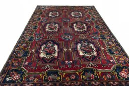 Surface texture of 1930s Bakhtiar rug with natural Wool and intricate pattern