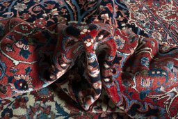 Backside of handmade 1930s Bakhtiar rug showing knot structure and weave density