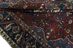 Corner detail of 1930s Bakhtiar rug showing border pattern and Wool pile