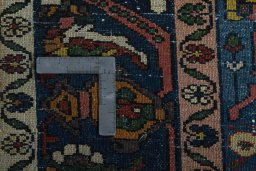 Surface texture of 1930s Bakhtiar rug with natural Wool and intricate pattern
