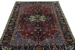Surface texture of 1930s Bakhtiar rug with natural Wool and intricate pattern