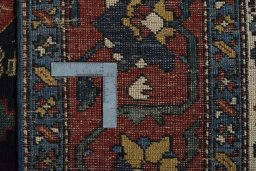 Backside of handmade 1930s Bakhtiar rug showing knot structure and weave density