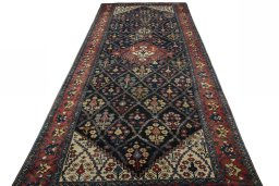 Surface texture of 1930s Bakhtiar rug with natural Wool and intricate pattern