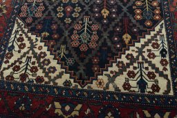 Close-up detail of 1930s Bakhtiar rug from Iran / Persia showing Wool weave
