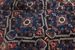 Corner detail of 1930s Bakhtiar rug showing border pattern and Wool pile