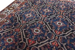 Backside of handmade 1930s Bakhtiar rug showing knot structure and weave density