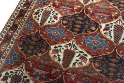 Backside of handmade 1950s Bakhtiar rug showing knot structure and weave density