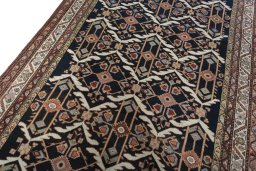 Backside of handmade New Bakhtiar rug showing knot structure and weave density