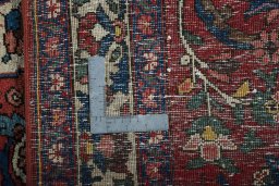 Backside of handmade 1950s Bakhtiar rug showing knot structure and weave density