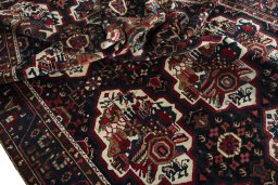 Corner detail of 1950s Bakhtiar rug showing border pattern and Wool pile