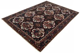 Corner detail of 1950s Bakhtiar rug showing border pattern and Wool pile