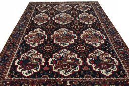 Surface texture of 1950s Bakhtiar rug with natural Wool and intricate pattern