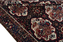 Full view of 1950s Bakhtiar rug from Iran / Persia, 302 × 218 cm in Blue tones