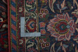 Backside of handmade 1930s Bakhtiar rug showing knot structure and weave density