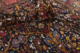 Surface texture of 1930s Bakhtiar rug with natural Wool and intricate pattern