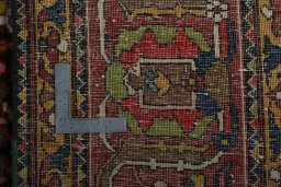 Backside of handmade 1930s Bakhtiar rug showing knot structure and weave density