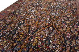 Backside of handmade 1930s Bakhtiar rug showing knot structure and weave density