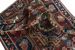 Surface texture of 1930s Bakhtiar rug with natural Wool and intricate pattern