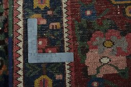 Backside of handmade 1930s Bakhtiar rug showing knot structure and weave density