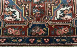 Full view of 1930s Bakhtiar rug from Iran / Persia, 234 × 148 cm in Red tones