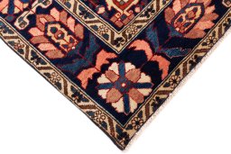 Backside of handmade 2001s Bakhtiar rug showing knot structure and weave density
