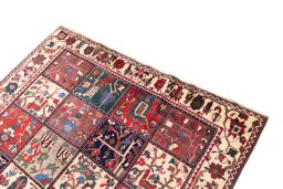 Surface texture of 1985s Bakhtiar rug with natural Wool and intricate pattern