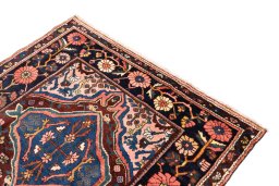 Surface texture of 1974s Bakhtiar rug with natural Wool and intricate pattern