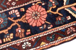 Backside of handmade 1974s Bakhtiar rug showing knot structure and weave density