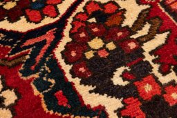 Backside of handmade 1990s Bakhtiar rug showing knot structure and weave density