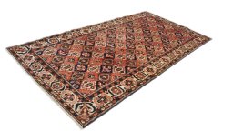 Corner detail of 1990s Bakhtiar rug showing border pattern and Wool pile