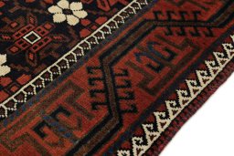 Central medallion detail of 1900s Baloch rug from Afghanistan
