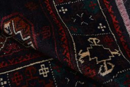 Close-up detail of 2000s Baloch rug from Iran / Persia showing Wool weave
