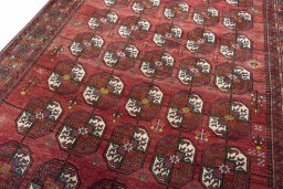 Backside of handmade 2000s Baloch rug showing knot structure and weave density